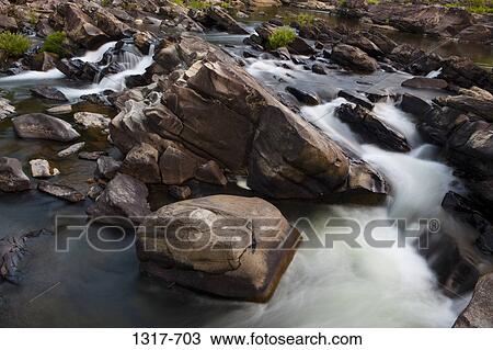 Stream flowing through rocks, Cossatot Falls, Arkansas, USA View Large Photo Image Stock Image - Stream flowing through rocks, Cossatot Falls, Arkansas, USA. Fotosearch