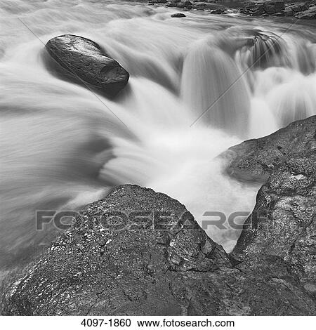 Stock Image - Stream flowing through rocks, Sunwapta Falls, Jasper National Park, Alberta, Canada. Fotosearch