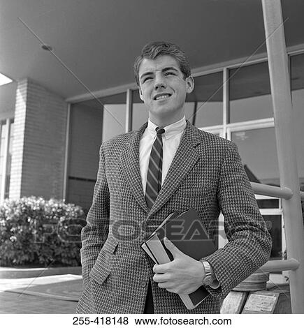 Stock Photo - Student holding books. Fotosearch