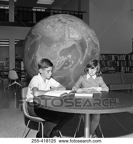Students reading book in library View Large Photo Image Stock Photography - Students reading book in library. Fotosearch