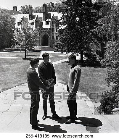 Stock Photography - Students standing in front of college building. Fotosearch