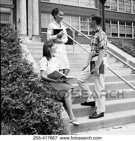 Stock Photo - Students talking on steps outside university. Fotosearch