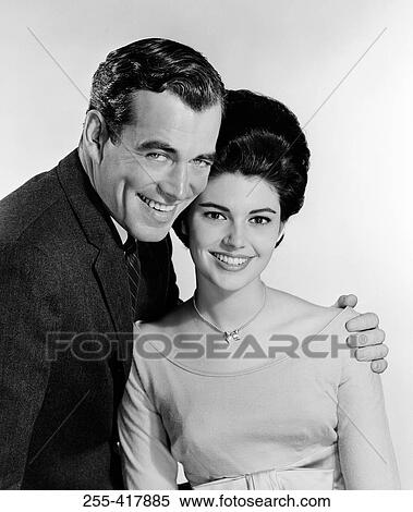 Studio portrait of couple embracing View Large Photo Image Stock Photography - Studio portrait of couple embracing. Fotosearch