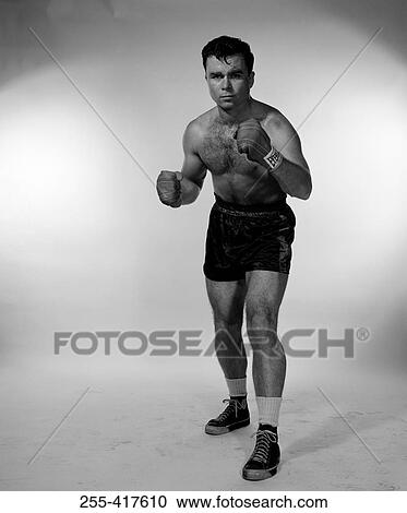 Studio portrait of male boxer View Large Photo Image Stock Image - Studio portrait of male boxer. Fotosearch