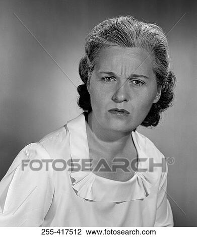 Studio portrait of mid adult woman View Large Photo Image Stock Image - Studio portrait of mid adult woman. Fotosearch