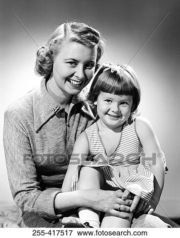 Stock Photo - Studio portrait of mother with daughter. Fotosearch