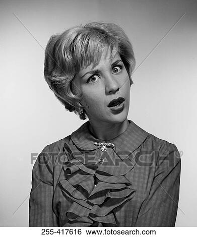 Stock Photograph - Studio portrait of serious young woman. Fotosearch