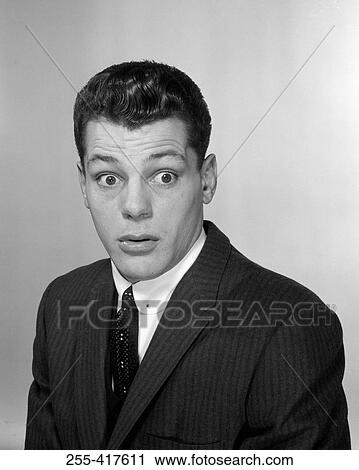 Studio portrait of surprised young businessman View Large Photo Image Stock Image - Studio portrait of surprised young businessman. Fotosearch