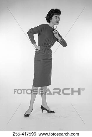 Studio portrait of young woman gesturing View Large Photo Image Stock Photograph - Studio portrait of young woman gesturing. Fotosearch