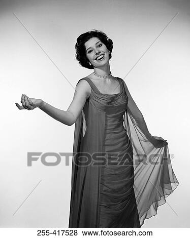 Stock Photo - Studio portrait of young woman smiling. Fotosearch