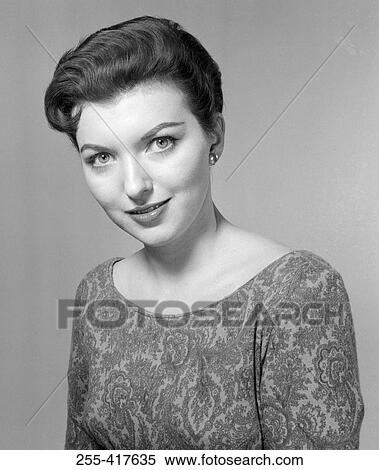 Studio portrait of young woman smiling View Large Photo Image Stock Photography - Studio portrait of young woman smiling. Fotosearch
