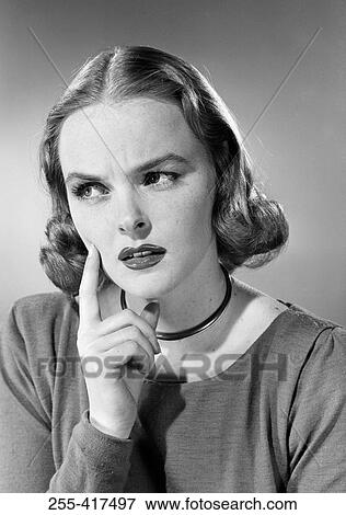 Studio portrait of young woman View Large Photo Image Stock Photo - Studio portrait of young woman. Fotosearch