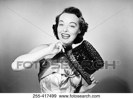 Stock Photo - Studio portrait of young woman wearing costume. Fotosearch
