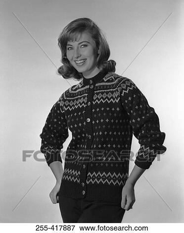 Studio portrait of young woman wearing cardigan View Large Photo Image Stock Photo - Studio portrait of young woman wearing cardigan. Fotosearch