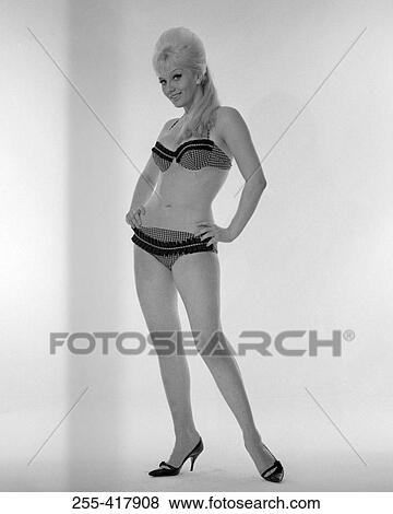 Studio portrait of young woman wearing bikini View Large Photo Image Stock Photo - Studio portrait of young woman wearing bikini. Fotosearch