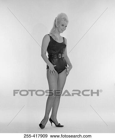 Stock Photo - Studio portrait of young woman wearing swimming costume. Fotosearch