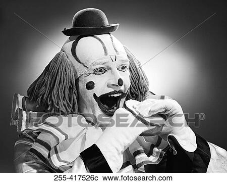 Studio shot of clown eating sandwich View Large Photo Image Stock Image - Studio shot of clown eating sandwich. Fotosearch