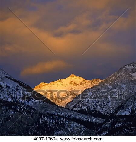Sunlight falling over mountain peak, Jasper National Park, Alberta, Canada View Large Photo Image Stock Image - Sunlight falling over mountain peak, Jasper National Park, Alberta, Canada. Fotosearch