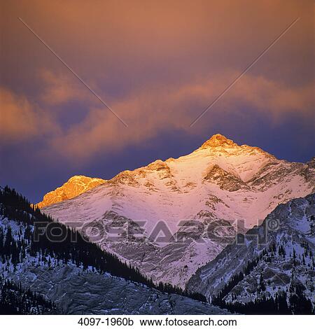 Sunlight falling over mountain peak, Jasper National Park, Alberta, Canada View Large Photo Image Stock Image - Sunlight falling over mountain peak, Jasper National Park, Alberta, Canada. Fotosearch