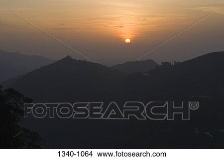 Sunrise over mountains, Coaker's Walk, Kodaikanal, Tamil Nadu, India View Large Photo Image Picture - Sunrise over mountains, Coaker's Walk, Kodaikanal, Tamil Nadu, India. Fotosearch