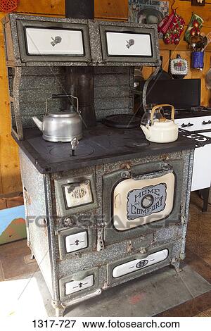 Tea kettle on a old wood burning oven, Crystal, Colorado, USA View Large Photo Image Stock Photo - Tea kettle on a old wood burning oven, Crystal, Colorado, USA. Fotosearch