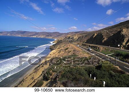 Stock Image - Toll road passing through mountains, Cabo San Lucas, Ensenada, Baja California, Mexico. Fotosearch