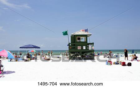 Tourists on the beach, Siesta Key Beach, Siesta Key, Sarasota County, Florida, USA View Large Photo Image Picture - Tourists on the beach, Siesta Key Beach, Siesta Key, Sarasota County, Florida, USA. Fotosearch