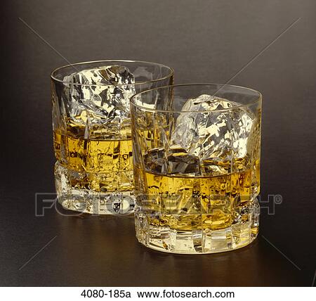 Two glasses of scotch with ice cube View Large Photo Image Stock Image - Two glasses of scotch with ice cube. Fotosearch