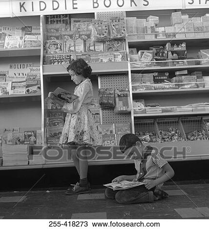 Stock Image - Two kids in kiosk. Fotosearch