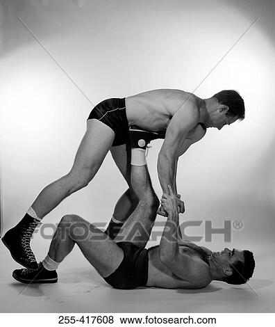 Stock Photo - Two men wrestling. Fotosearch