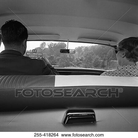 Picture - Two people in car. Fotosearch