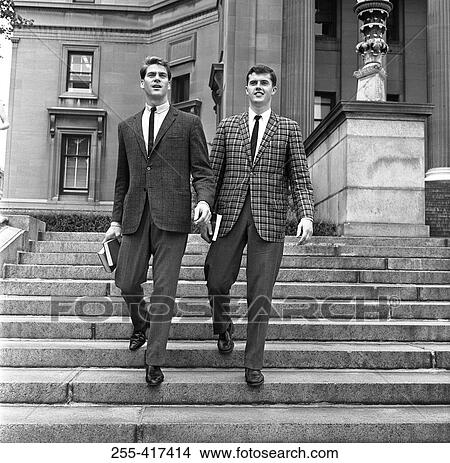 Two well dressed young men going down on stairs View Large Photo Image Picture - Two well dressed young men going down on stairs. Fotosearch