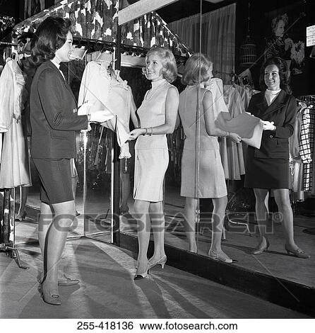 Stock Photograph - Two women in clothes store. Fotosearch