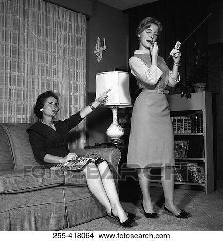Two women in living room View Large Photo Image Picture - Two women in living room. Fotosearch