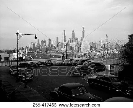 USA, New York City, cars in parking lot with Manhattan skyline View Large Photo Image Stock Image - USA, New York City, cars in parking lot with Manhattan skyline. Fotosearch