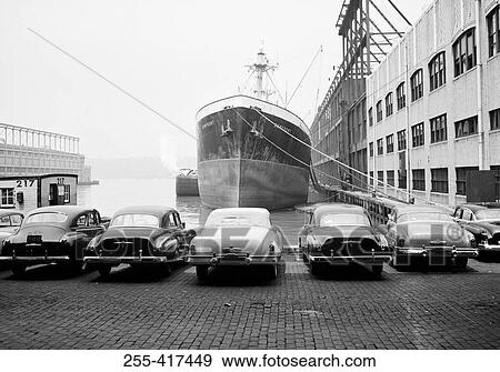 Stock Photo - USA, New York City, cars parked in harbor. Fotosearch
