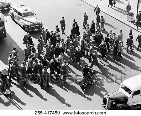 USA, New York City, high angle view of pedestrians crossing street View Large Photo Image Stock Photo - USA, New York City, high angle view of pedestrians crossing street. Fotosearch