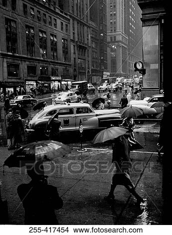 Picture - USA, New York City, street scene on rainy day. Fotosearch