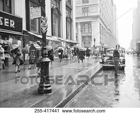Stock Image - USA, New York City, street scene on rainy day. Fotosearch