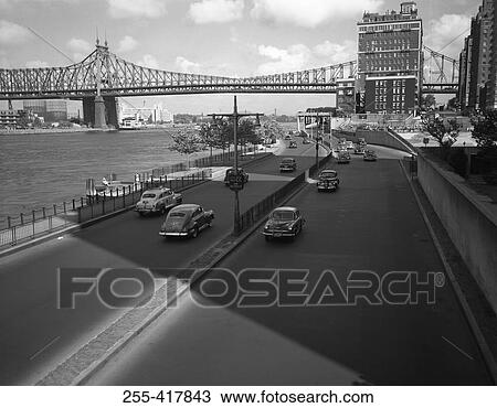 USA, New York State, New York city, street and bridge over river View Large Photo Image Stock Image - USA, New York State, New York city, street and bridge over river. Fotosearch