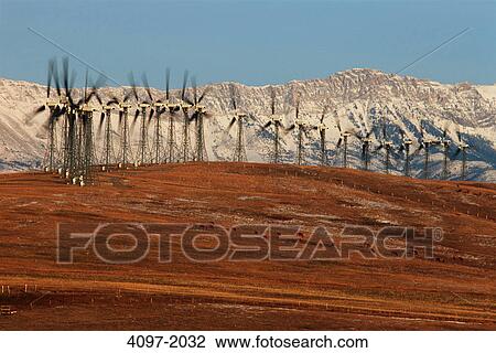 Stock Image - Wind turbine on a hill, Alberta, Canada. Fotosearch