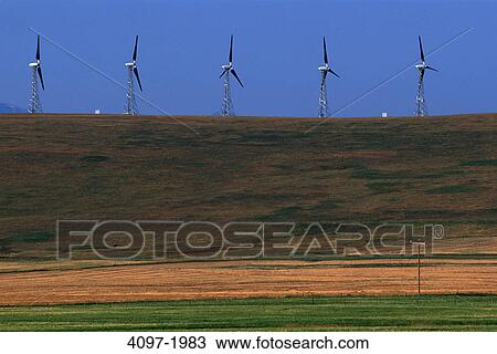 Stock Image - Wind turbines in a field, Alberta, Canada. Fotosearch