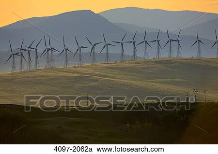 Stock Image - Wind turbines on a hill, Alberta, Canada. Fotosearch