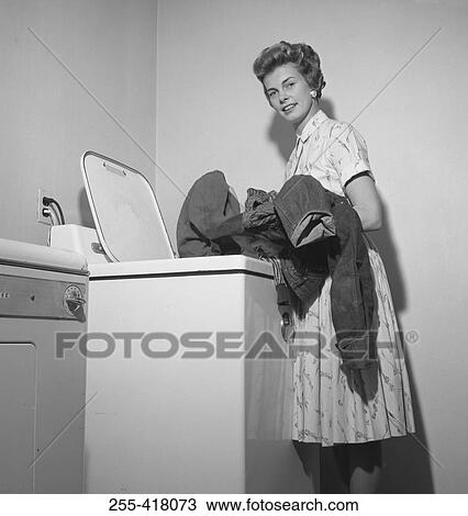 Stock Image - Woman doing laundry. Fotosearch