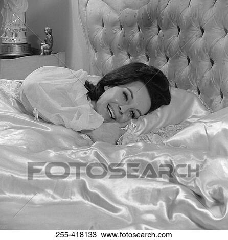 Stock Image - Woman in bed. Fotosearch