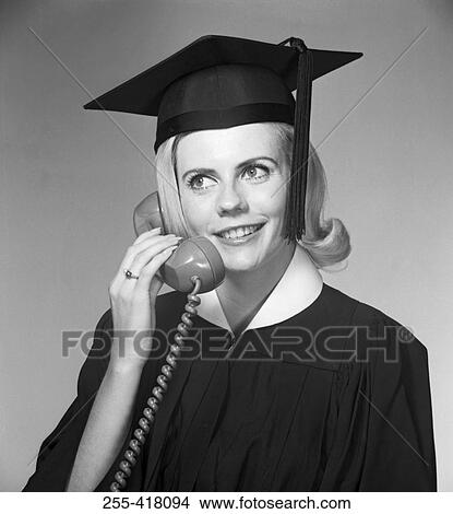Picture - Woman in mortar board talking on phone. Fotosearch