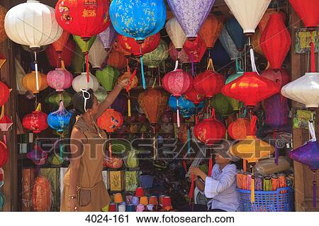 Woman looking at paper lanterns, Hoi An, Vietnam View Large Photo Image Stock Image - Woman looking at paper lanterns, Hoi An, Vietnam. Fotosearch