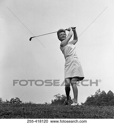 Stock Image - Woman plying golf. Fotosearch