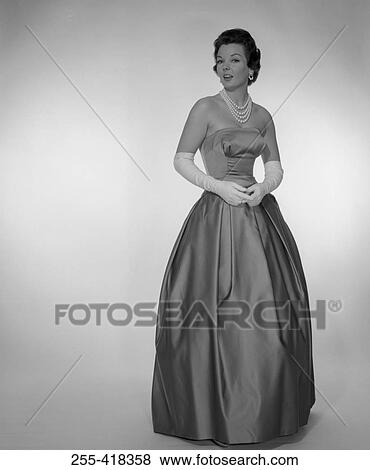 Stock Photo - Woman wearing elegance dress. Fotosearch