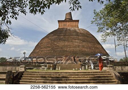 Woman with an umbrella at a stupa, Abhayagiri Dagaba, Anuradhapura, Sri Lanka View Large Photo Image Stock Photography - Woman with an umbrella at a stupa, Abhayagiri Dagaba, Anuradhapura, Sri Lanka. Fotosearch